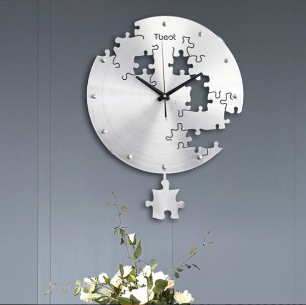 16 Inch Circilar Creative Wall Clock Art Wall Watch Modern Design LiviSeries: Metal Size: 38*50CM 
Mirror Material: NO 
Shell Material: Aluminium Alloy 
Suitable: Living Room, Dining Room, Bedroom 
Note: it is not include the battery, 16 Inch Circilar Creative Wall Clock Art Wall Watch Modern Design Living Room